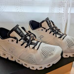 On Running Black and White Athletic Shoes with Ventilated Design